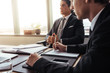 © Jacob Lund - Businessman sitting at his desk with colleague