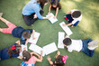 © AntonioDiaz - Top view of preschool students learning and taking a class outdoors