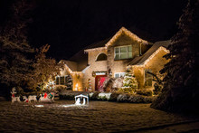 Decorated House For Christmas At Night