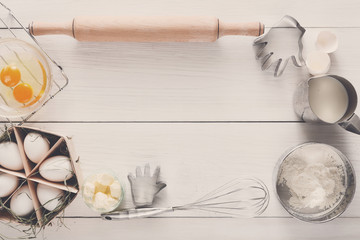 Baking ingredients on rustic white background