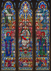 LONDON, GREAT BRITAIN - SEPTEMBER 16, 2017: The stained glass of Jesus Christ the Pantokrator, Virgin Mary, St. Joseph and the Evangelists in church St Etheldreda by Joseph Edward Nuttgens (1952).