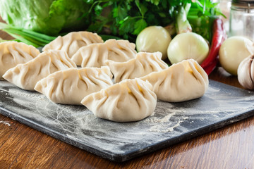 Raw gyoza or jiaozi dumplings ready for cooking