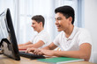 © LIGHTFIELD STUDIOS - young happy teenager boys studying on computers