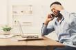 © Prostock-studio - Young black businessman talking on mobile phone