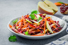Raw Carrot Beetroot Apple Salad With Ginger Lime Dressing On Stone Background. Selective Focus, Copy Space.