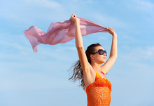 Woman Flying Cloth At The Beach