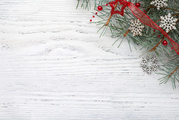 Wall Mural - Fir branch with Christmas decorations on old wooden shabby background with copy space for text