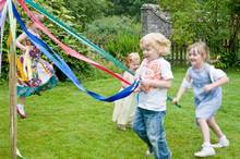 Children Dancing Round A Maypole