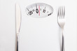 scales with fork and knife, diet and slimming concept