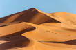 Leinwandbild Motiv landscape of golden sand dune with blue sky in Sahara desert
