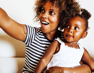 adorable sweet young afro-american mother with cute little daugh