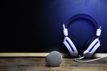 Microphone and headphone background blackboard.