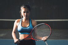 Young Woman Asia Holding Tennis Racket.