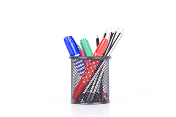 colorful pens and pencil in holder isolated on white background