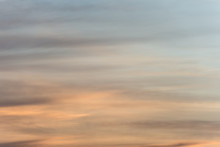 Sunset Sky Background With A Golden Orange Glow On A Hazy Clouds