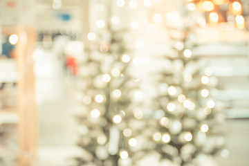 Poster - Christmas tree with light string and ball decoration at abstract blur home interior bokeh background,Backdrop for winter festive holiday celebration concept.