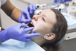 © daylight917 - Teenage girl at a dentist's reception. Dental treatment, braces