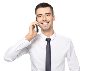 Canvas Print - Attractive businessman talking on phone against white background