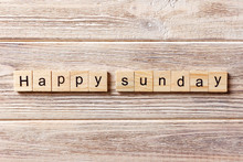 Happy Sunday Word Written On Wood Block. Happy Sunday Text On Table, Concept