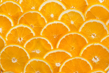 Bright Orange Background From Slices Of Juicy Orange. Healthy Food, Background.