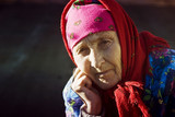 Fototapeta Tulipany - Sad face of an old grandmother close-up