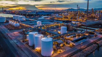 aerial view oil terminal is industrial facility at night for storage of oil and petrochemical produc