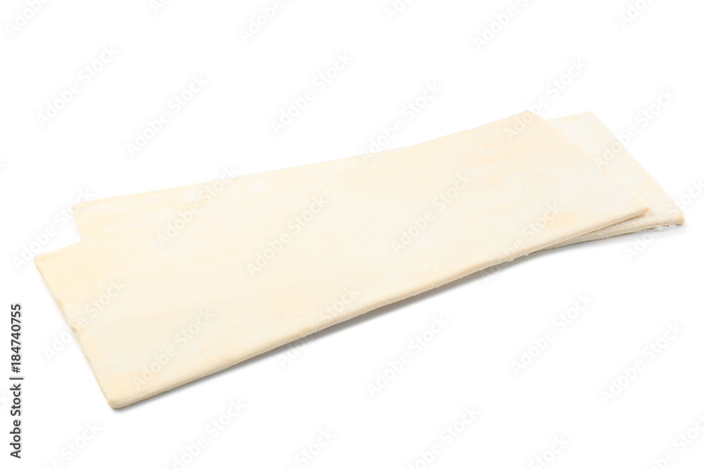Raw puff pastry on white background
