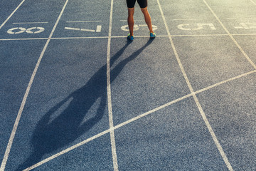 Wall Mural - sprinter standing on running track