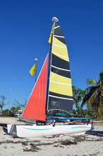Twin Hulled Sailing Catamaran Resting On A Beach In  Key Biscayne,Florida