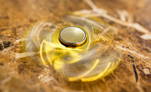 The Golden Spinner Is Spinning On The Table