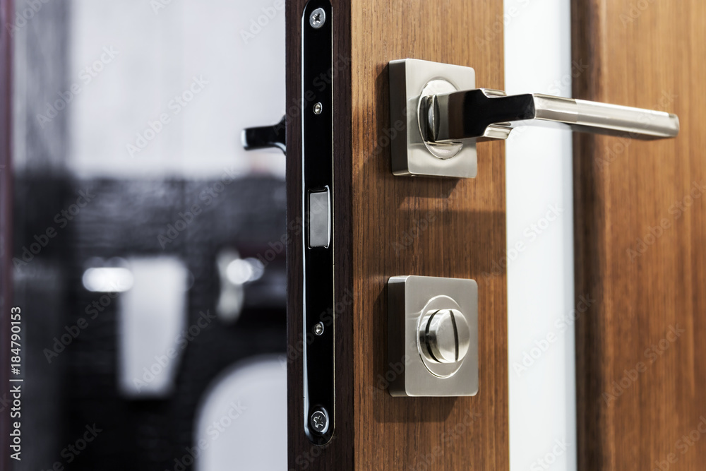door handle and latch of brass on veneer doors - obrazy, fototapety, plakaty 