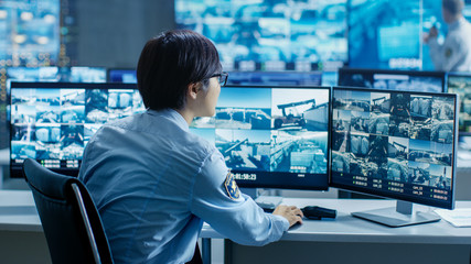 Aufkleber - In the Security Control Room Officer Monitors Multiple Screens for Suspicious Activities. He's Surrounded by Monitors and Guards Facility of National Importance.