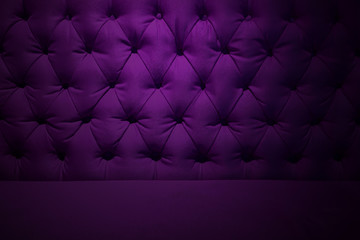Purple burgundy velvet texture or background and soft tufted fabric furniture diamond pattern decoration with buttons.