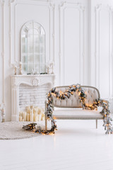 White classic interior with fireplace and christmas decorations.