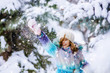 © sushytska - Cute girl ready to throw snowball during day