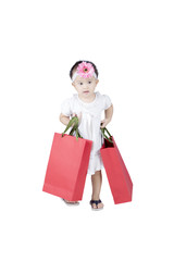 Sticker - Cute girl carrying shopping bags on studio