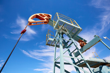 Wall Mural - Pumpjack. A pumpjack is the overground drive for a reciprocating piston pump in an oil well. The arrangement is commonly used for onshore wells producing little oil. 