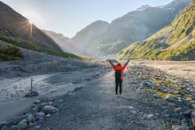 Woman Tourist Trekking To The Fox Glacier In New Zealand