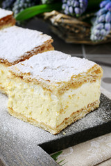 Canvas Print - A Polish cream pie made of two layers of puff pastry, filled with whipped cream.