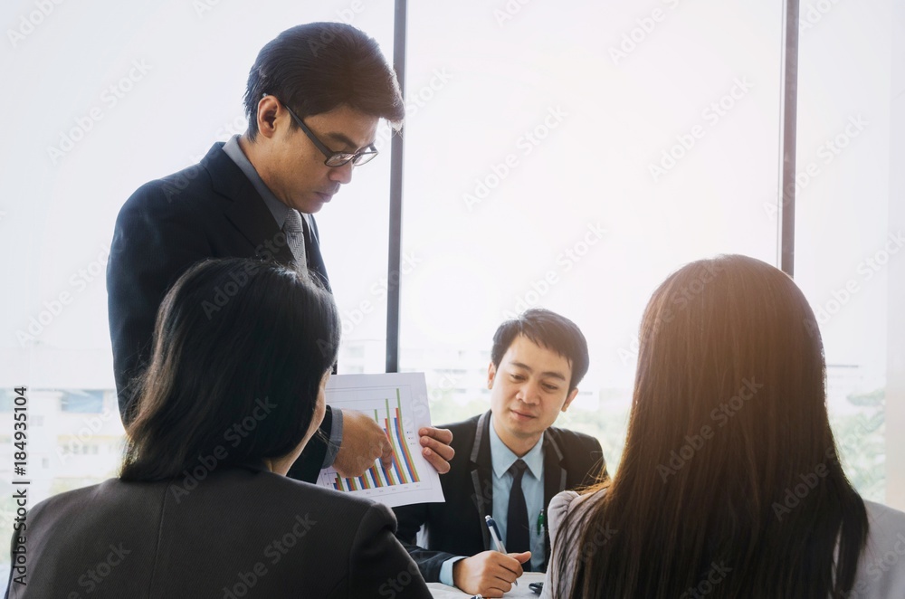 Manager Asian Report asian project manager showing and presenting growth chart diagram of ...