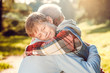 © Sergii - Grandfather and grandson together outdoors family concept