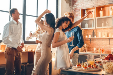 group of friends party together indoors celebration