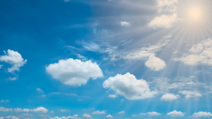 blue sky with clouds and sun
