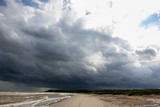 Fototapeta  - Rain clouds go on the coast bad weather