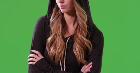 Wall Mural - Close up of white millennial girl wearing a hoodie on green screen. On green screen to be keyed or composited.