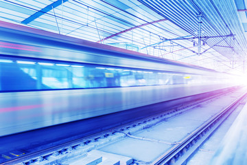 A train running at a subway station.