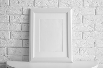 Mockup of blank frame on table