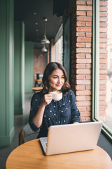 Fototapete - Beautiful cute asian young woman in the cafe, enjoy drinking coffee smiling