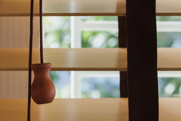 brown wood curtain control lighting at window