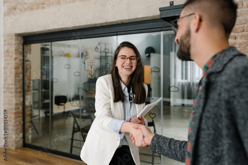 Cuadros en Lienzo Handshaking and smiling candidly at a job interview